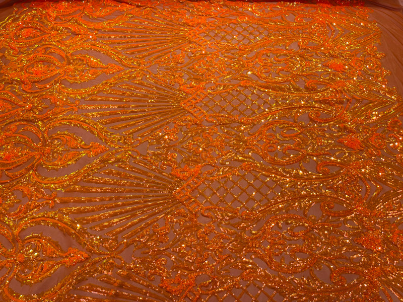 Orange iridescent sequin damask design on a 4 way stretch mesh- sold by the yard.