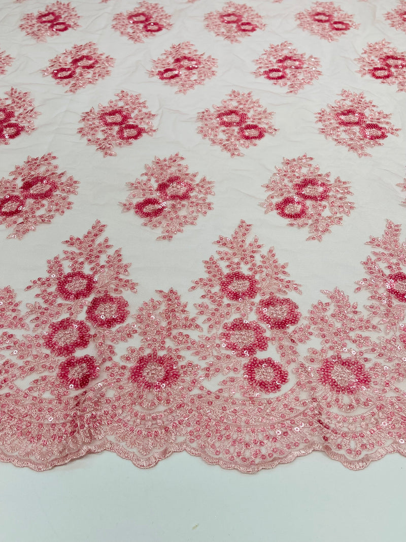 Floral corded embroider with sequins on a mesh lace fabric-sold by the yard