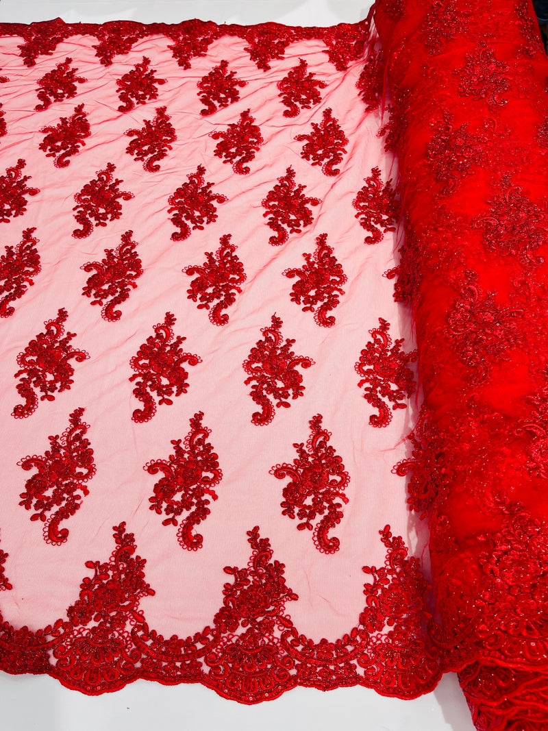 Red metallic floral design embroidery on a mesh lace with sequins and cord-sold by the yard.