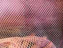 AB Rhinestones on a fish net fabric | New Creation Fabric & Foam Inc.