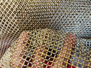 AB Rhinestones on a fish net fabric | New Creation Fabric & Foam Inc.