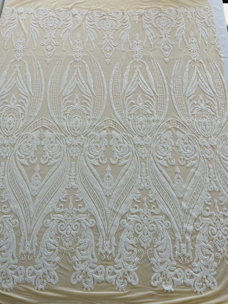 Empire Damask design with sequins embroider on a 4 way stretch mesh fabric-sold by the yard.