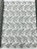 Estrella corded flowers embroider with sequins on a mesh lace fabric-sold by the yard.