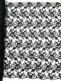 Estrella corded flowers embroider with sequins on a mesh lace fabric-sold by the yard.