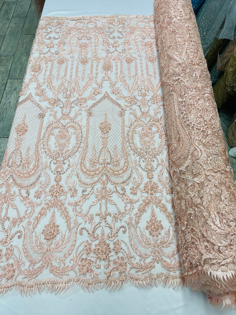 Diva design damask embroidery with heavy beaded on a mesh lace-sold by the yard.