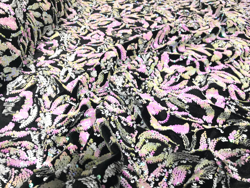 Pink, white iridescent sequins flip two tone floral design on a black stretch velvet, Sold by the yard.