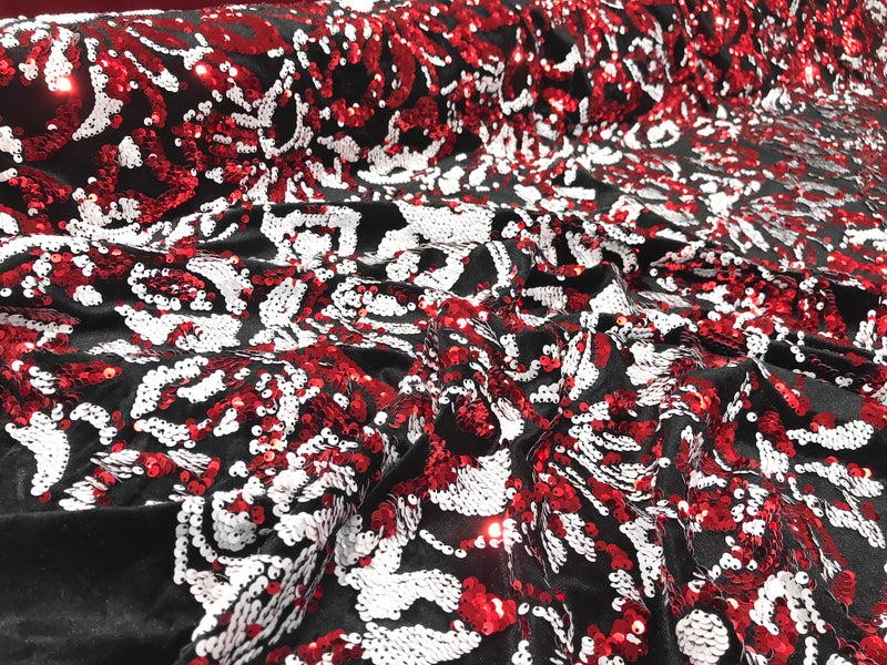 Red, white sequins flip two tone floral design on a black stretch velvet, Sold by the yard.